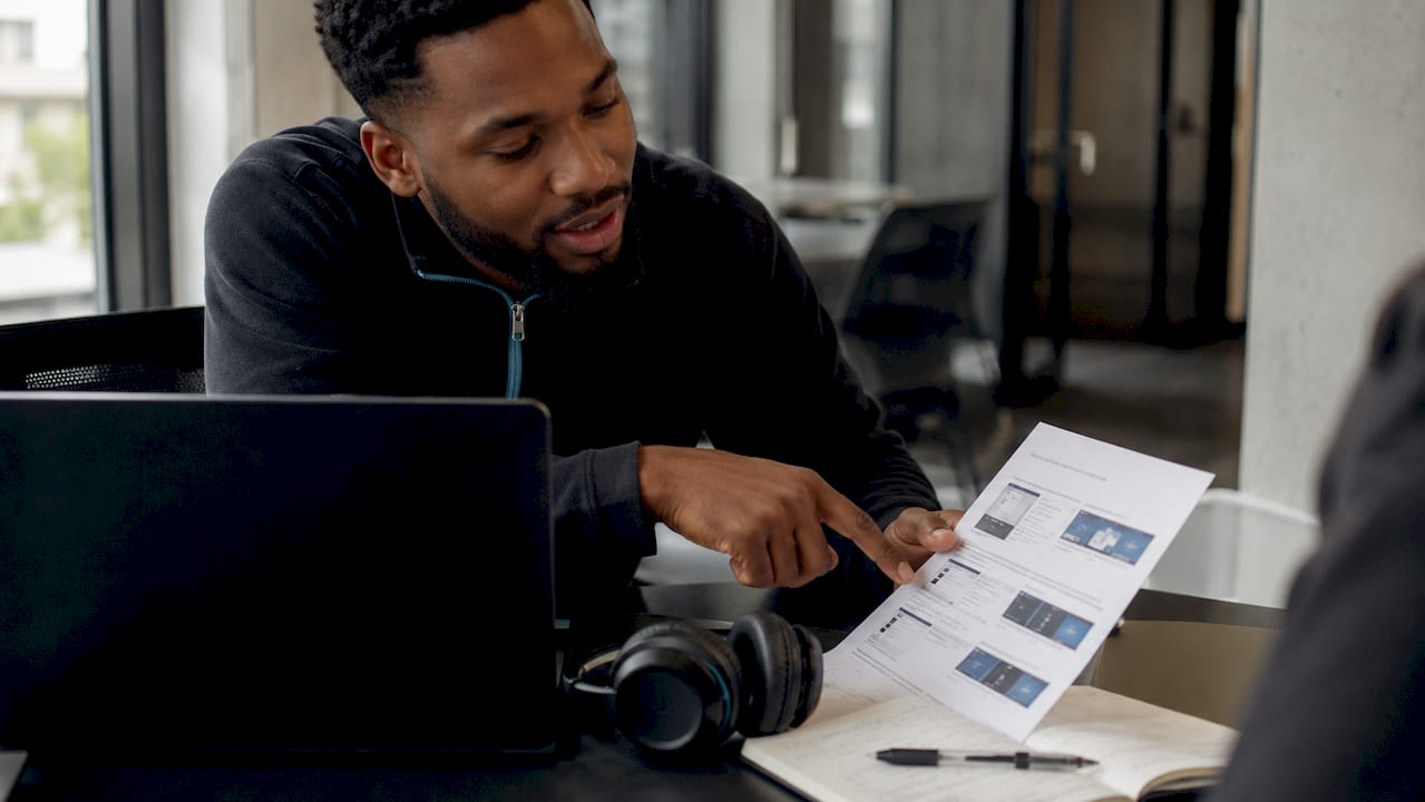 IT technician helping with Outlook setup
