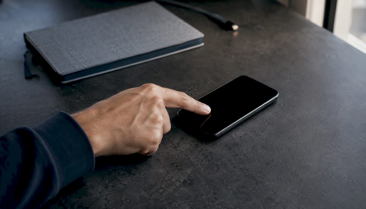 Hand pressing mobile form submit button