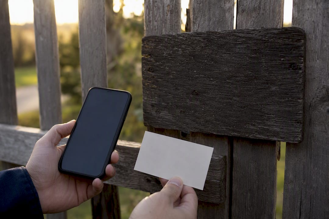 Smartphone with business card and address plaque