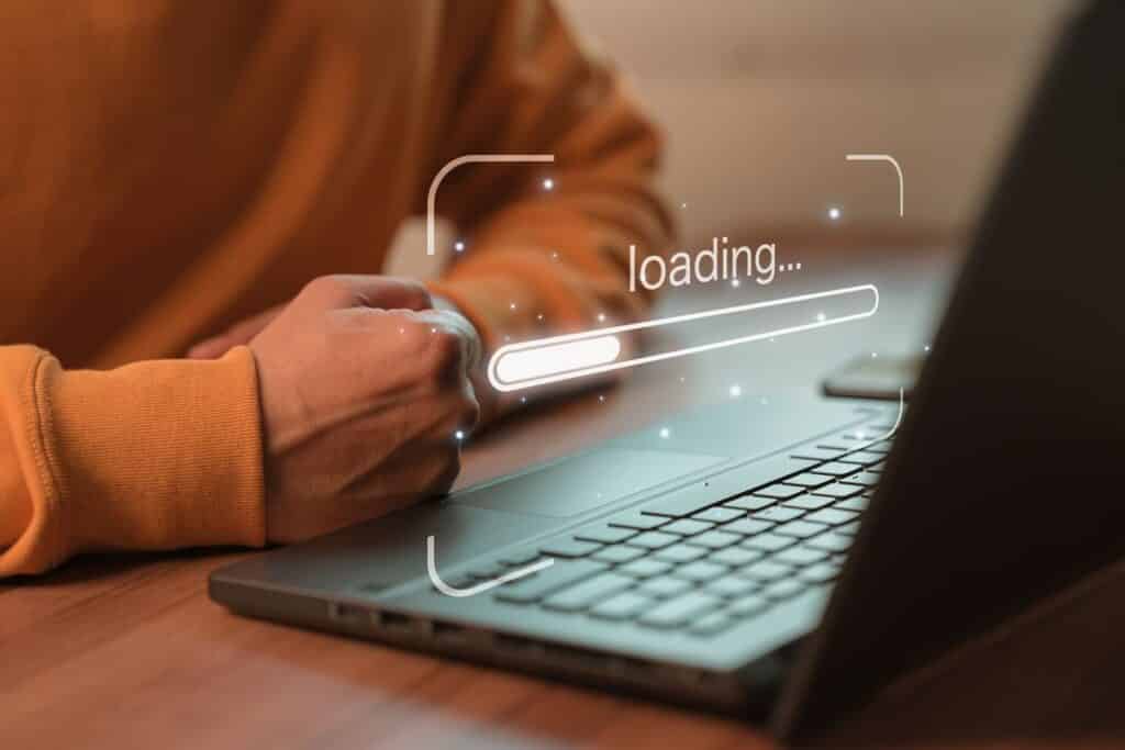 Man using laptop for download software and waiting to loading digital business data form website, concept of waiting for load of loading bar.